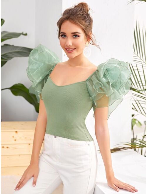 exaggerated ruffle top