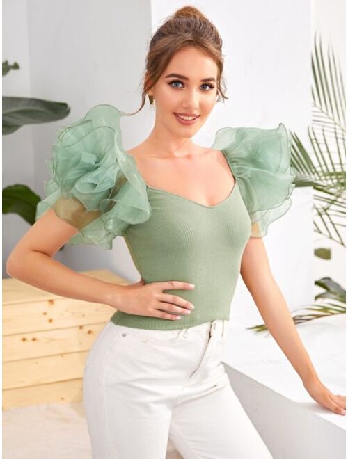 exaggerated ruffle top