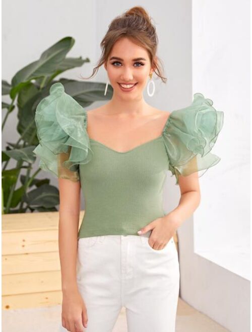 exaggerated ruffle top