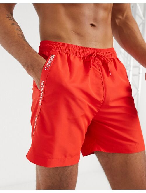 Calvin Klein medium length swim trunks in red