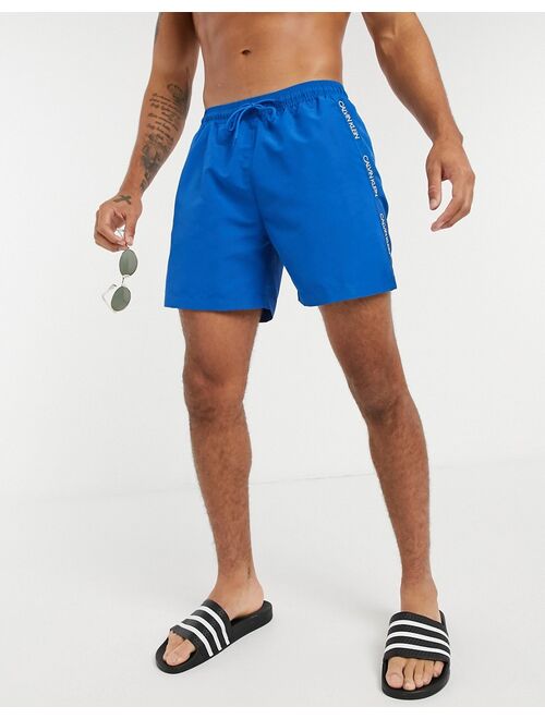 Calvin Klein medium length swim trunks in blue