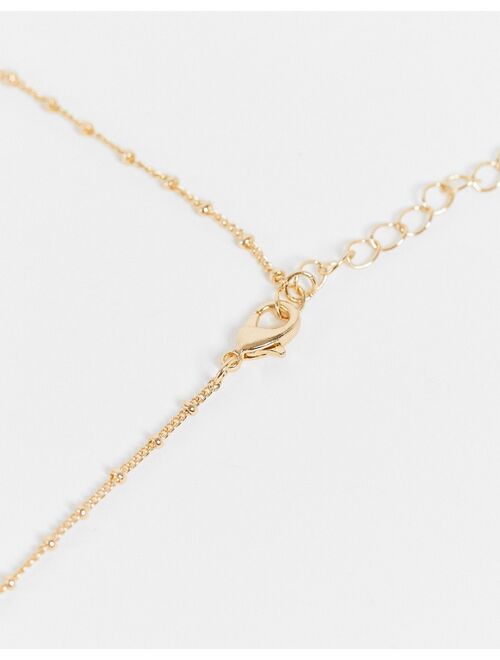 Asos Design necklace with sun pendant in gold tone