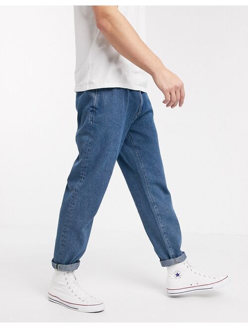 Asos Design DESIGN double pleat jeans in light blue