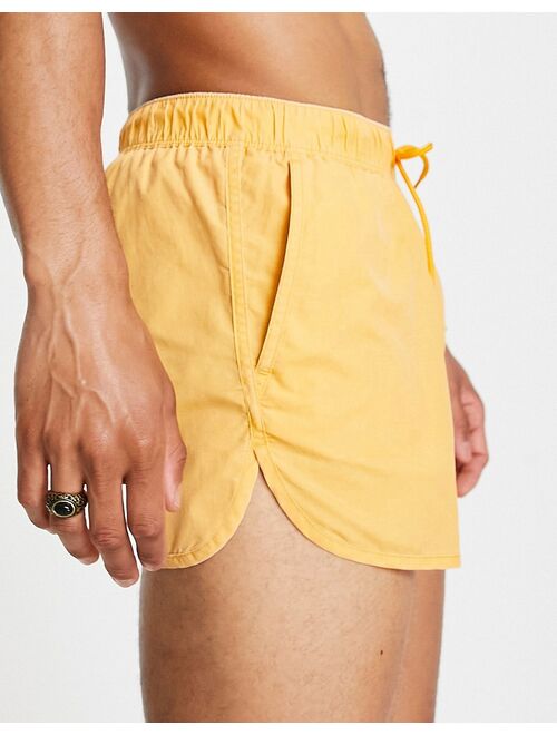 Asos Design runner swim shorts in yellow acid wash