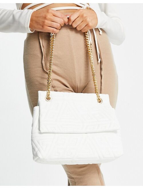 Asos Design white adjustable shoulder bag in embossed monogram