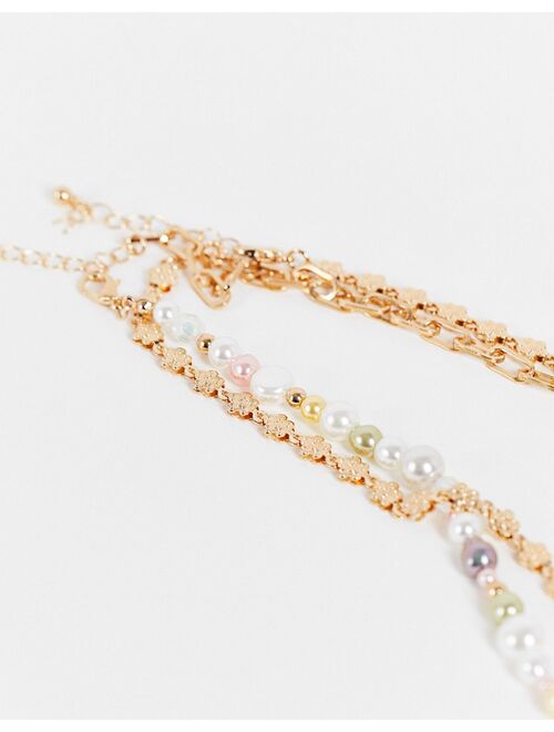 Reclaimed vintage inspired multirow necklace with mixed chain and pastel faux pearls in gold