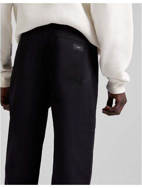 Bershka tapered chinos in black