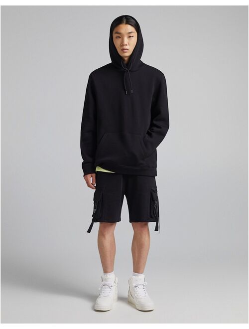 Bershka join life pocket hoodie in black