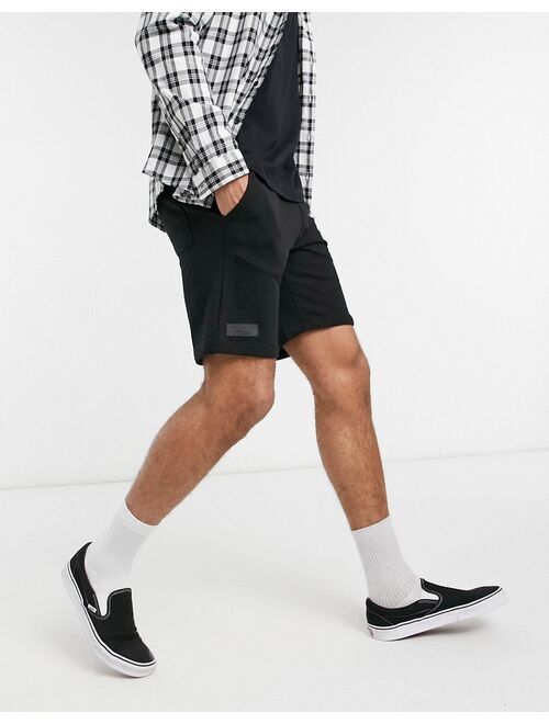 Bershka jersey shorts in black