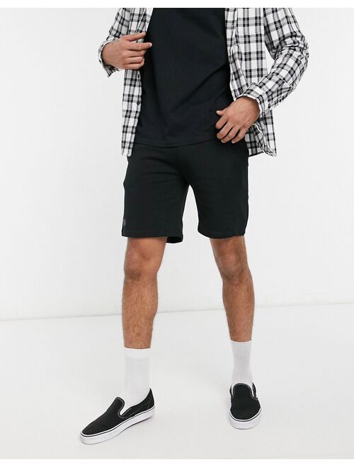 Bershka jersey shorts in black