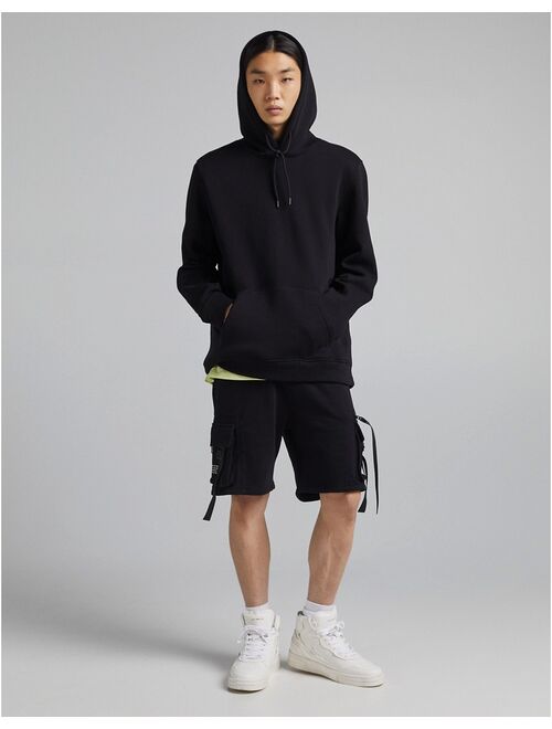 Bershka multipocket cargo shorts in black