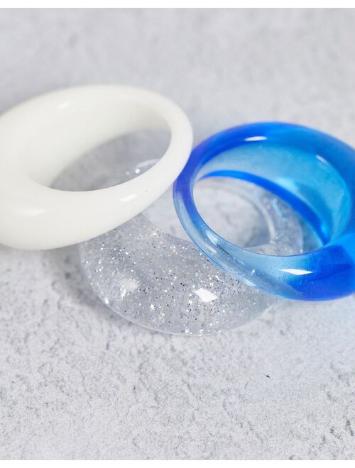 Asos Design Curve pack of 3 domed rings in blue cream and glitter