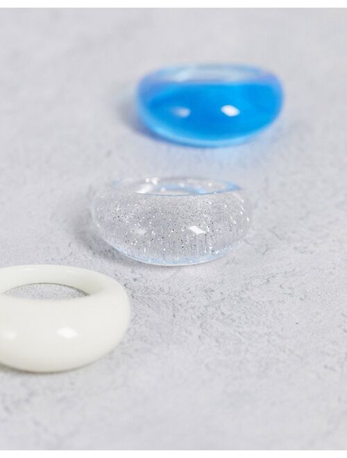 Asos Design Curve pack of 3 domed rings in blue cream and glitter