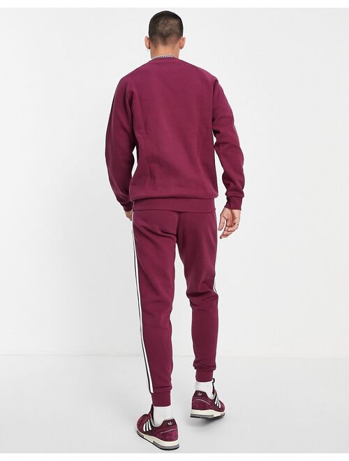 Adidas Originals Originals adicolor three stripe sweatshirt in plum