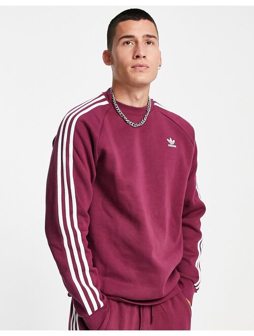 Adidas Originals Originals adicolor three stripe sweatshirt in plum