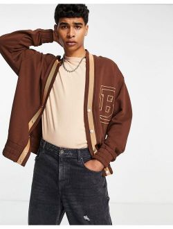 oversized jersey cardigan in brown with varsity letter embroidery