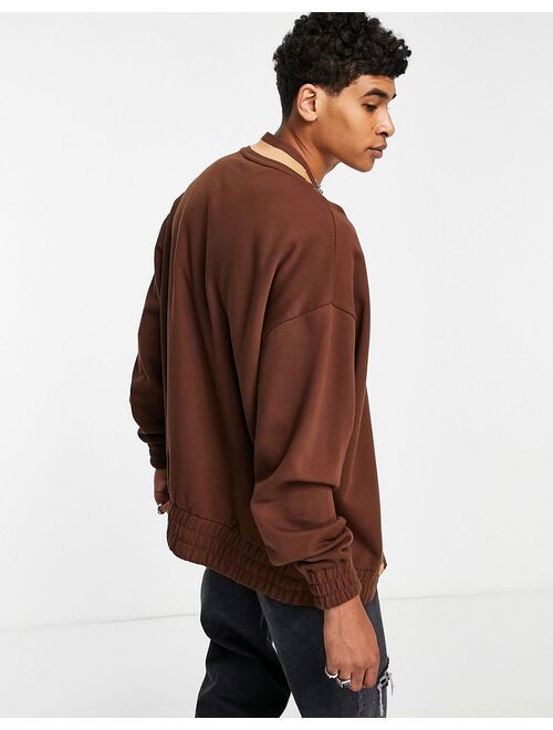 Asos Design oversized jersey cardigan in brown with varsity letter embroidery