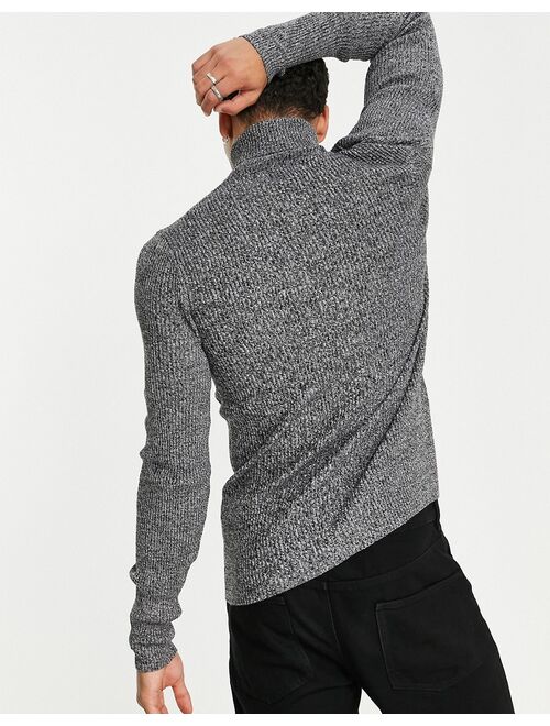 Asos Design muscle fit ribbed rollneck sweater in black and white twist