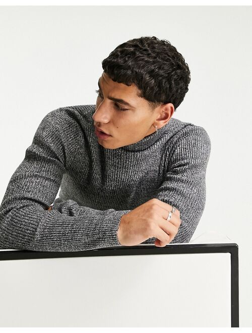 Asos Design muscle fit ribbed rollneck sweater in black and white twist