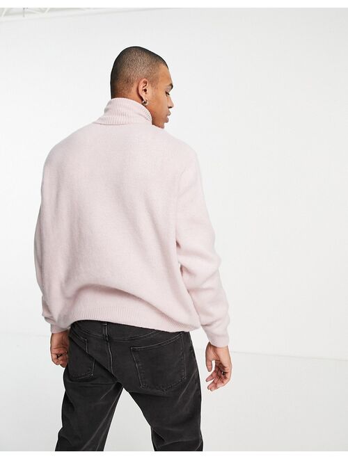 Asos Design fluffy knit roll neck sweater in pink