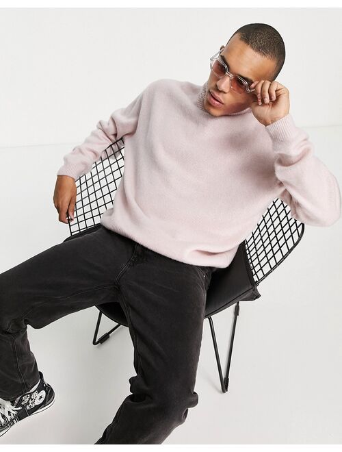 Asos Design fluffy knit roll neck sweater in pink