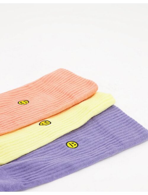 Asos Design happy face embroidered crew socks in pastel tones