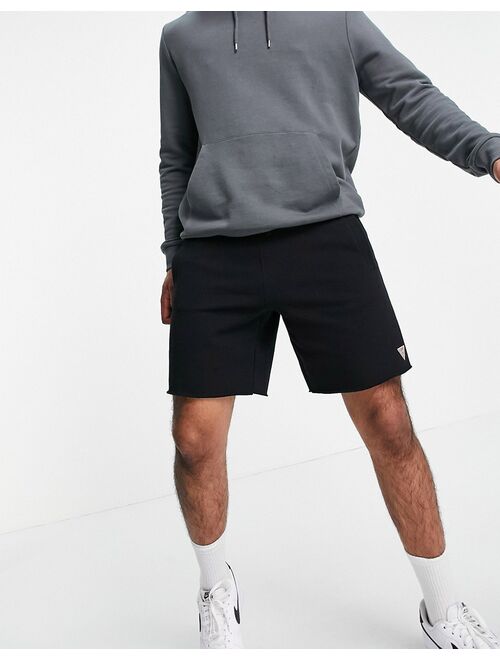 Guess shorts in black with small logo