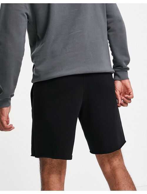 Guess shorts in black with small logo