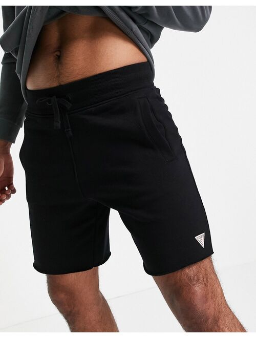 Guess shorts in black with small logo