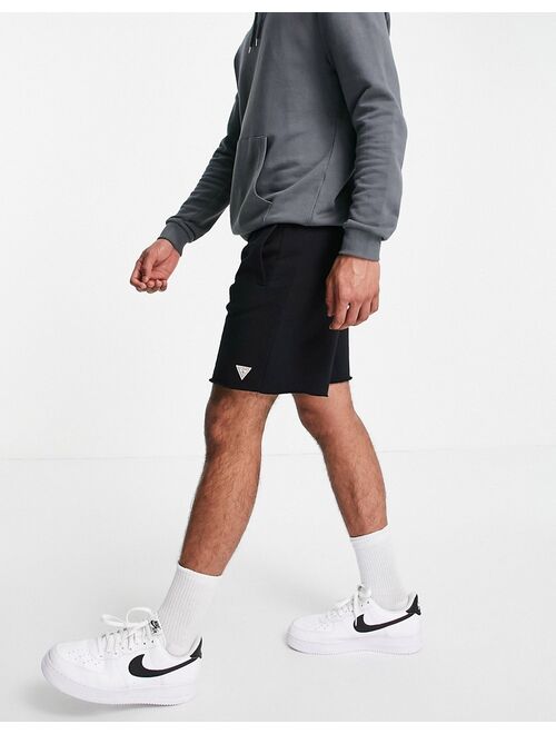 Guess shorts in black with small logo