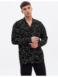 long sleeve oversized shirt with face sketch print in black