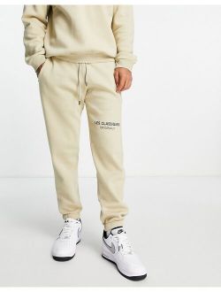branded logo oversized sweatpants in beige - part of a set