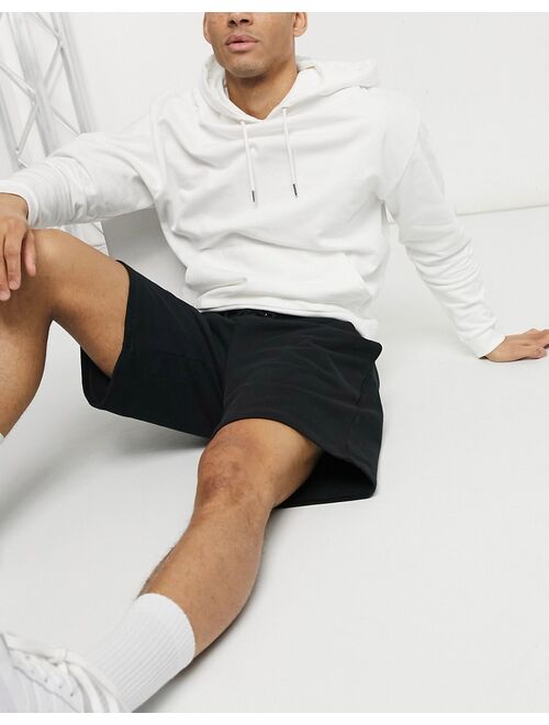 Asos Design oversized jersey shorts in black