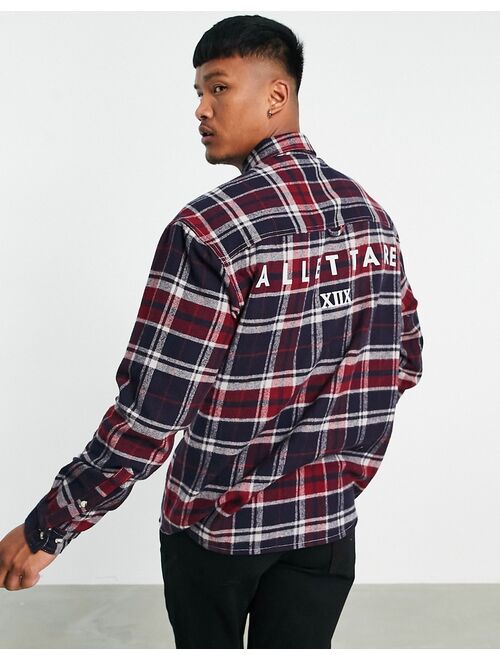 Asos Design 90s oversized shirt in brushed flannel check with back text print