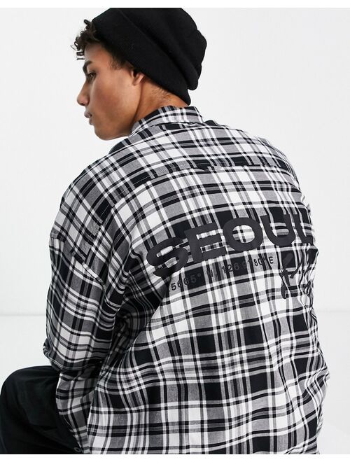 Asos Design 90s oversized check shirt with city back print