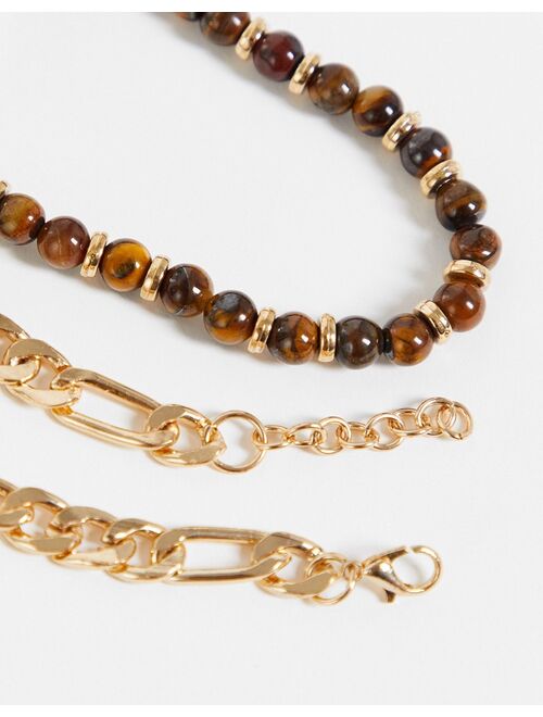 Asos Design 2 pack bracelet set with tigers eye beads and gold tone figaro chain