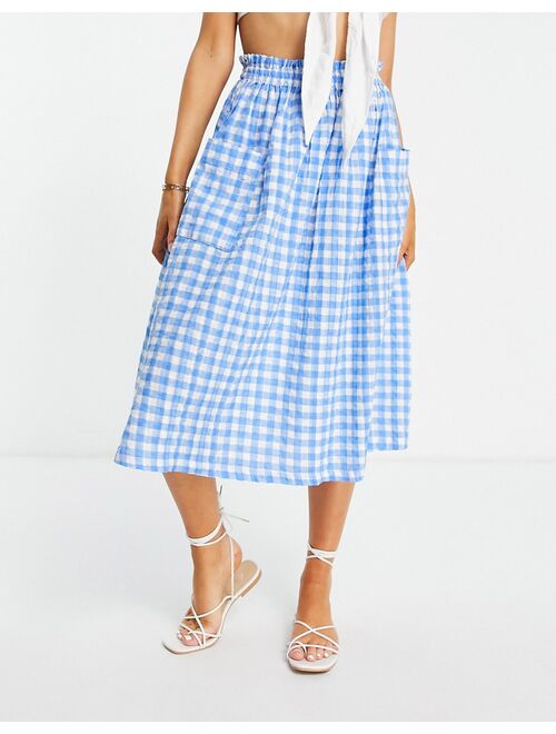 ASOS DESIGN midi skirt with pocket detail in seersucker blue & white gingham print