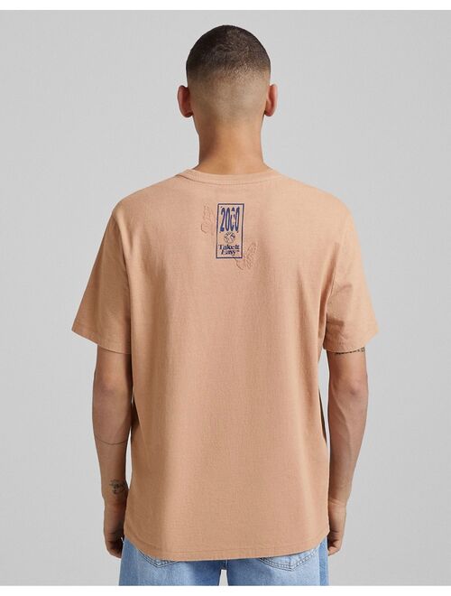 Bershka embossed printed t-shirt in camel