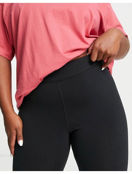 Nike Plus Swoosh mid rise leggings in black