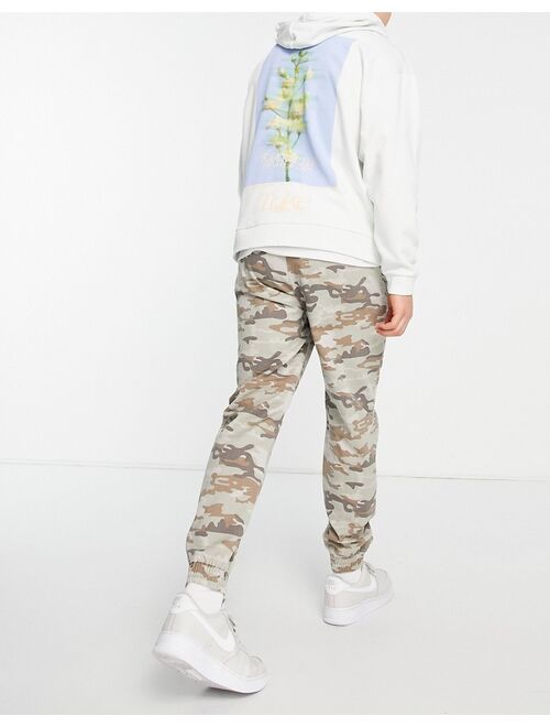 River Island zip pocket cargo pants in camo