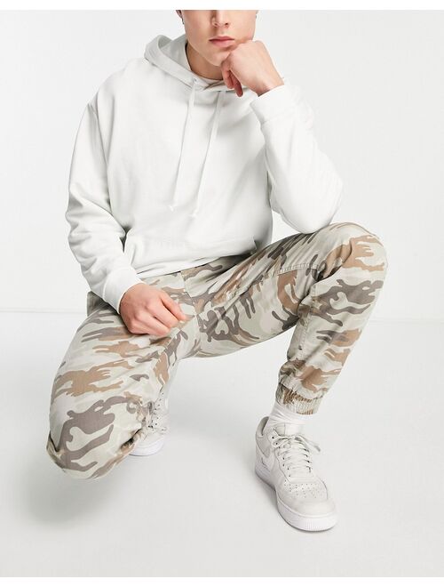 River Island zip pocket cargo pants in camo