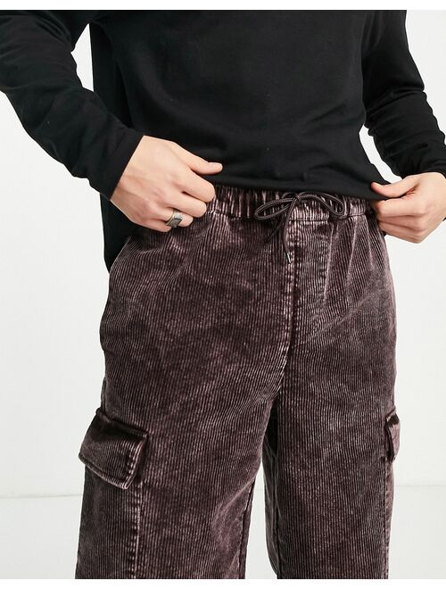 ASOS DESIGN relaxed cord pants with cargo pockets and acid wash