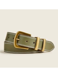 Leather belt with large gold buckle
