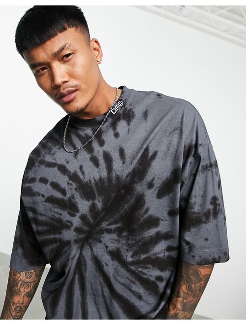 Asos Design ASOS Dark Future oversized t-shirt with spiral tie dye and blurred logo graphic print in black