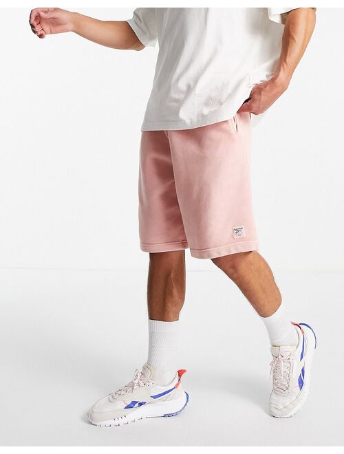 Reebok natural dye sweat shorts in pastel pink