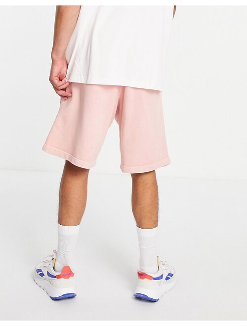 Reebok natural dye sweat shorts in pastel pink