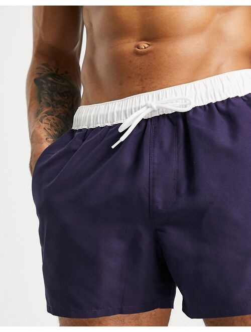 ASOS DESIGN swim shorts in navy with white tipping