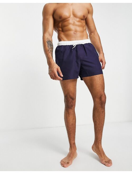 ASOS DESIGN swim shorts in navy with white tipping