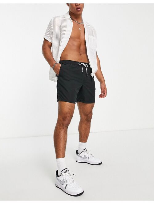 ASOS DESIGN swim shorts in black mid length