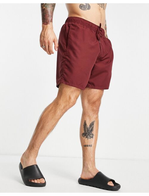 ASOS DESIGN swim shorts in burgundy